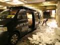 Sonia digging snow into the Animal van - it took 7 hours to build the wallride (copyright Mark Haysom 2010)