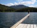 CJ makes the most of the good weather, log-walking in Lost Lake in front of a dramatic Whistler Mountain backdrop